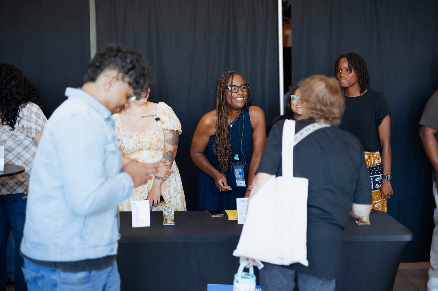 People connecting around a table in the Movement Church lobby