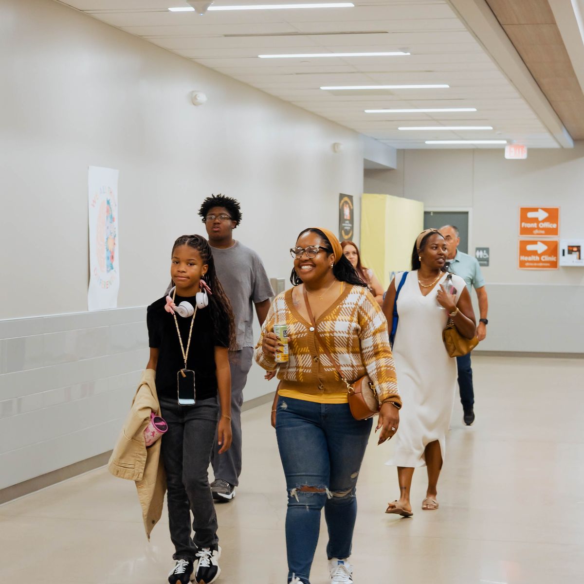 Friends laughing together in the hallway at Movement Church